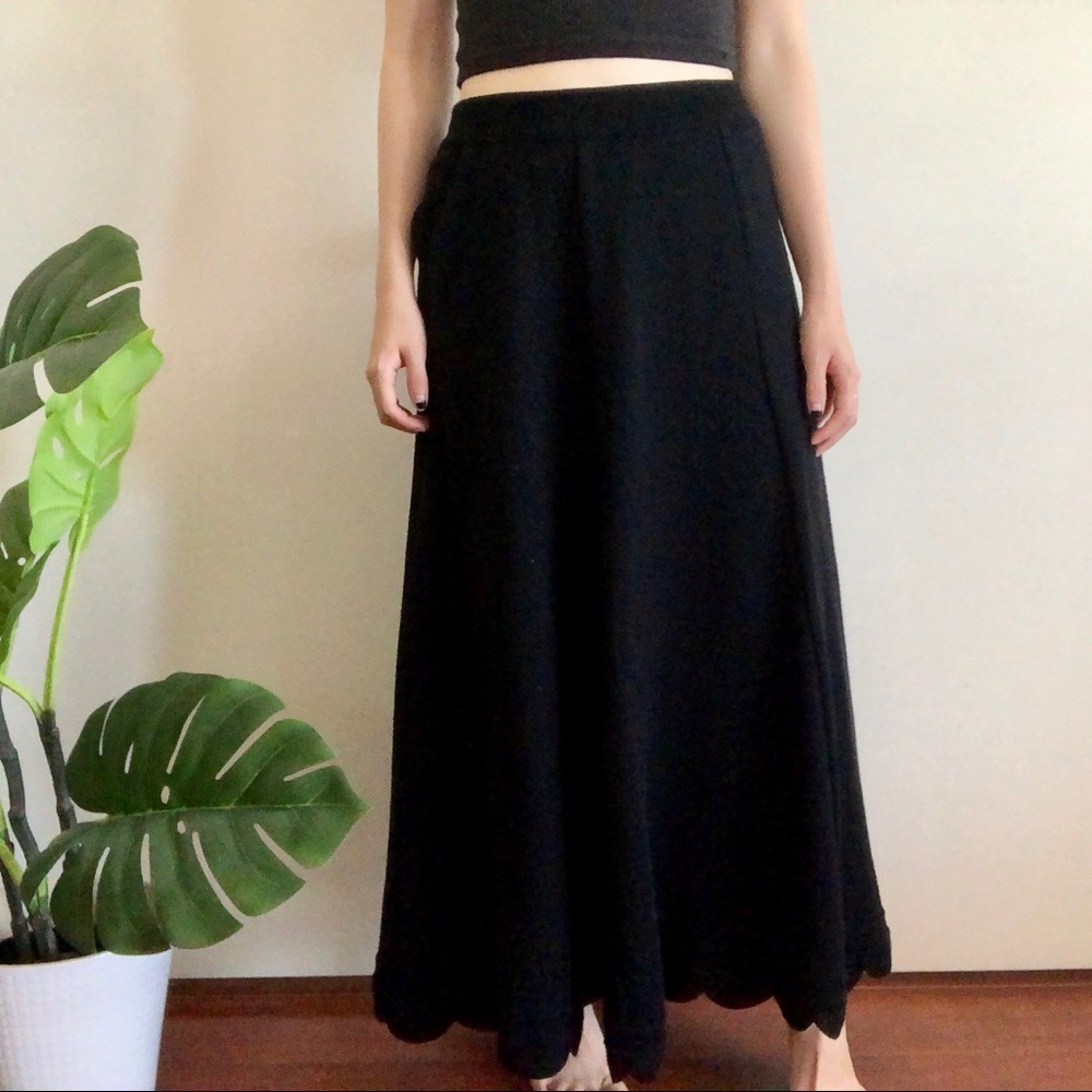 Long black wool skirt with scalloped hemline